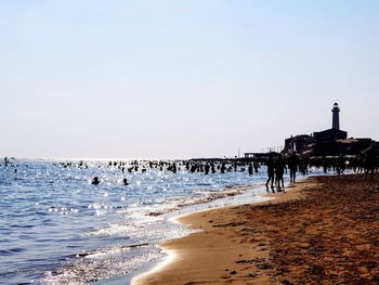 Scenic view of beach against clear sky