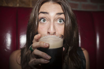 Young woman enjoying a drink