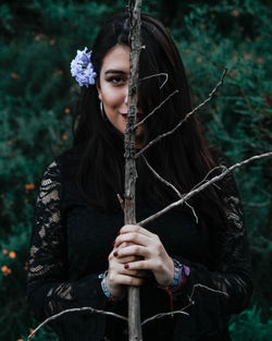 Portrait of a beautiful young woman in forest