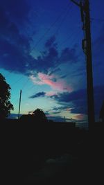 Silhouette landscape against scenic sky