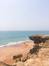 Scenic view of beach against clear sky