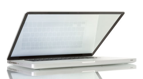 Close-up of laptop on table against white background