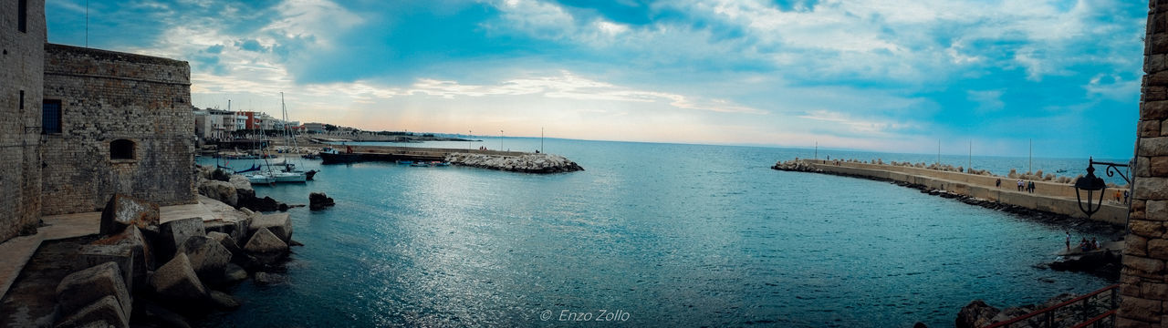 PANORAMIC VIEW OF SEA AGAINST BUILDINGS