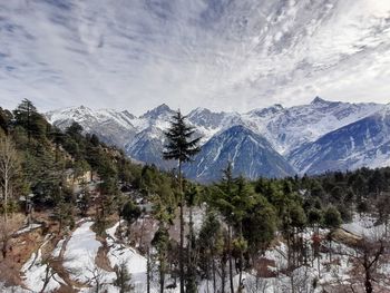 Scenic view of snowcapped mountains against sky