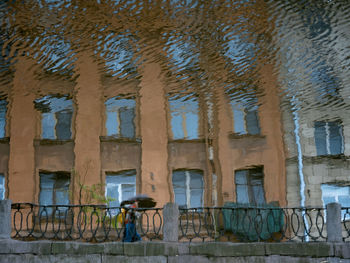 Woman standing against wall