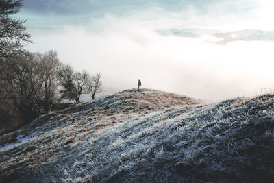 Scenic view of snow covered landscape against sky