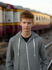 Portrait of boy standing on train