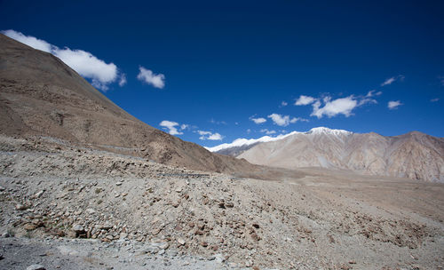 Scenic view of arid landscape against sky