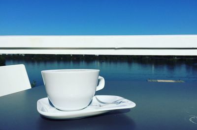 Close-up of coffee on table against sky