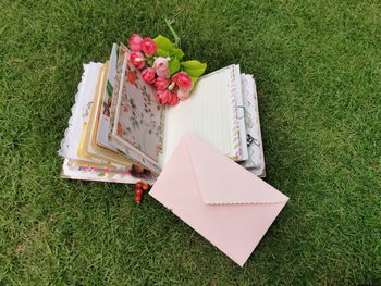 High angle view of open book on field