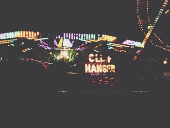 Low angle view of illuminated lights at night