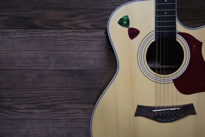 High angle view of guitar on table