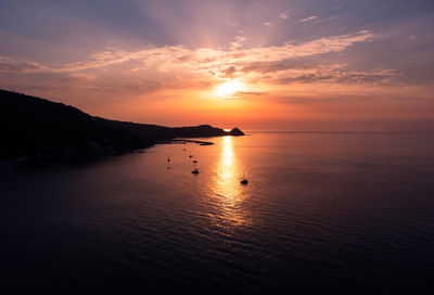 Scenic view of sea against sky during sunset