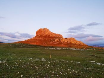 Scenic view of landscape and mountain against sky