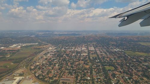 Aerial view of cityscape against sky