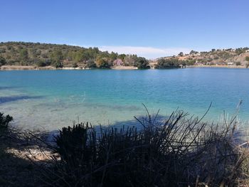 Scenic view of sea against clear blue sky