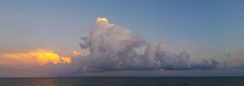 Panoramic view of sea against sky at sunset