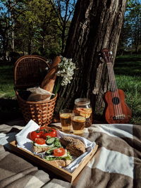 Fruits and vegetables in basket on table