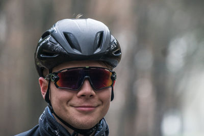 Close-up of man wearing sunglasses and cycling helmet