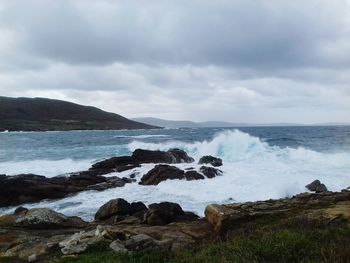 Scenic view of sea against dramatic sky
