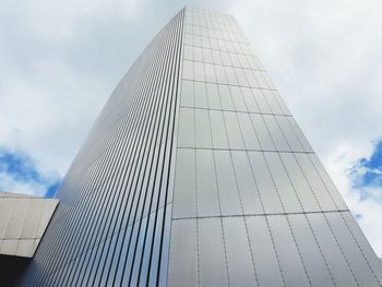 Low angle view of modern skyscraper against sky