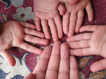 Midsection of couple holding hands