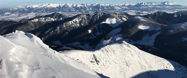 Scenic view of snowcapped mountains during winter