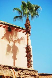 Low angle view of built structure against clear blue sky
