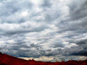 Scenic view of mountains against cloudy sky