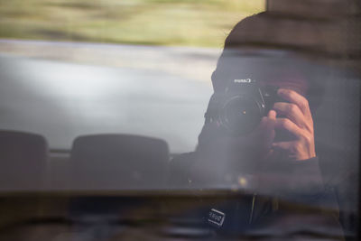 Close-up of man using mobile phone