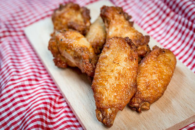 Close-up of fried chicken on cutting board