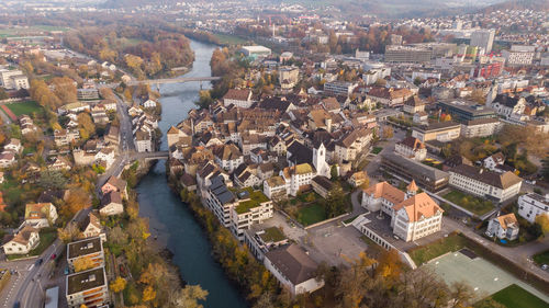 High angle view of river amidst buildings in city