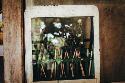 Reflection of paintbrush on window frame