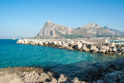 Scenic view of sea against clear blue sky