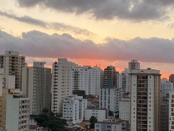 High angle view of buildings against sky during sunset