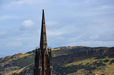 Tower against mountains