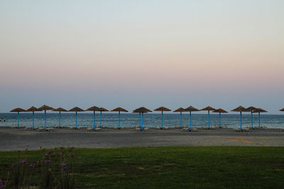 Scenic view of sea against clear sky during sunset