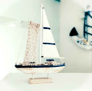Close-up of sailboat hanging on table at home