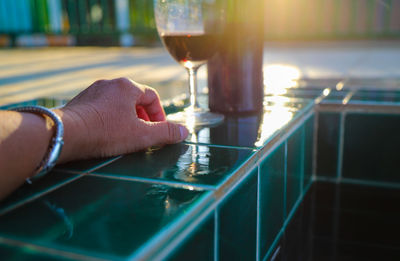 Close-up of hand holding wine glass