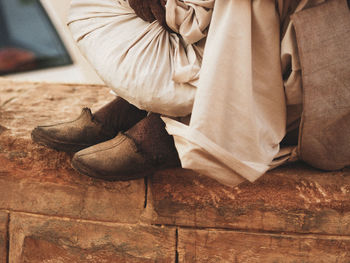 Low section of woman sitting on floor