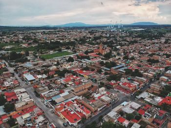 High angle shot of townscape against sky