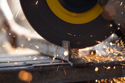 Closeup of circular grinder cutting iron