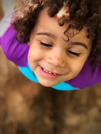 Close-up of smiling girl with eyes closed