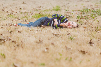 Smiling boy lying on grass