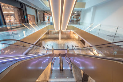 High angle view of escalator in illuminated building