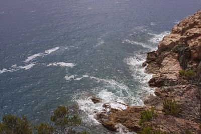 High angle view of rock formation in sea