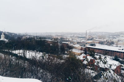 Cityscape against clear sky during winter