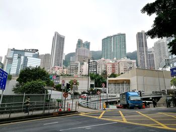 City street and modern buildings against sky