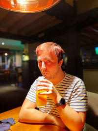 Portrait of drinking juice at hotel