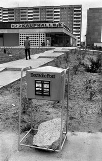 Rear view of man standing by building